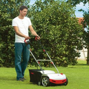 a man using an AL-KO electric scarifier