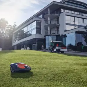 a robotic mower cutting a lawn