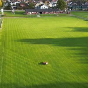 a robotic mower creating a patterned lawn