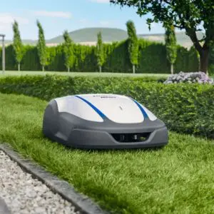 the Honda HRM4000BC LIVE Robotic Lawn Mower cutting a lawn's boundary
