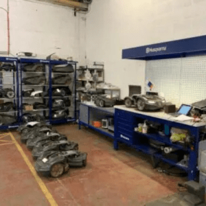 robot mowers in a workshop waiting to be serviced