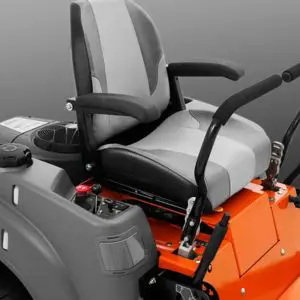a close up of the driver's seat and controls of a zero turn mower