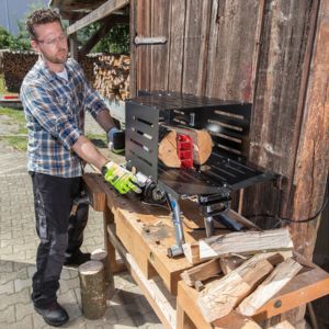 a man splitting logs into firewood, using the AL-KO Easy LSH 3704 Electric Log Splitter