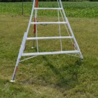 a close up of the bottom part of a Henchman tripod ladder