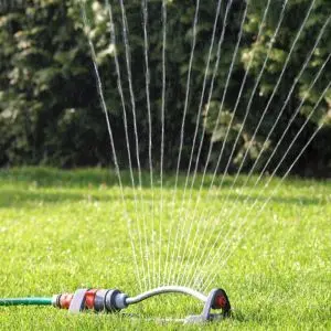 a water sprinkler system watering a lawn
