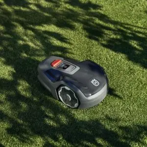 the Husqvarna Automower® Aspire™ R4 on a shaded lawn