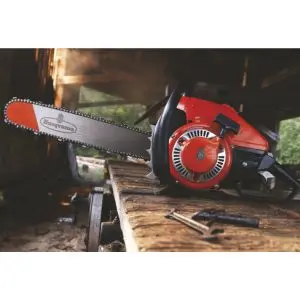 a 1959 red Husqvarna 90 chainsaw on a wooden table