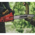 someone using an ECHO top handle chainsaw to prune a tree branch