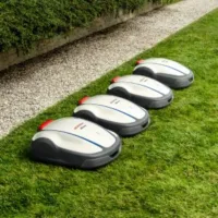4 Honda Miimo robotic mowers in a line, on a lawn