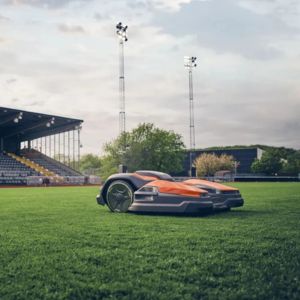 a Husqvarna Ceora™ 544 EPOS™ Robot Mower on a football pitch