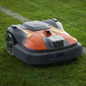 the Husqvarna Automower® 580 EPOS® Robot Mower mowing a sports field next to the touchline