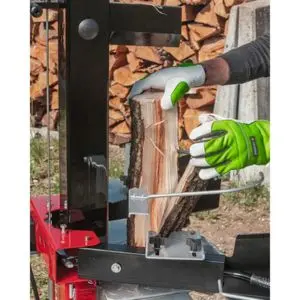a person wearing gloves, removing a split log from the AL-KO LSV 5506 Electric Log Splitter