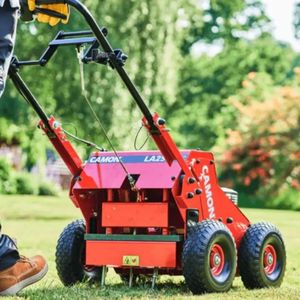 a reverse shot of the Camon LA25 Petrol Lawn Aerator in a garden