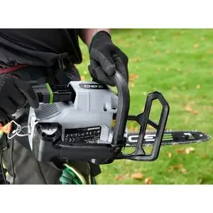 a man holding the EGO CSX3002 PRO X Cordless Top Handle Chainsaw