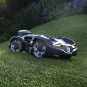 the Husqvarna Automower® 435X AWD NERA Robotic Mower travelling across an undulating lawn
