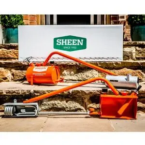 2 orange Sheen flame guns, sat on steps outside a house, below a sign advertising Sheen