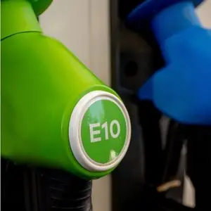 a close up of a green E10 petrol fuel pump