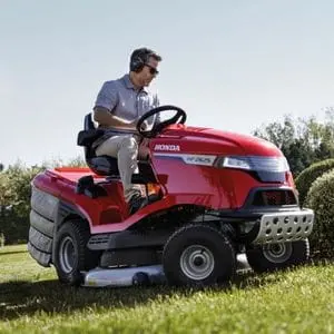 a man cutting a large lawn using the Honda HF2625 Riding Mower