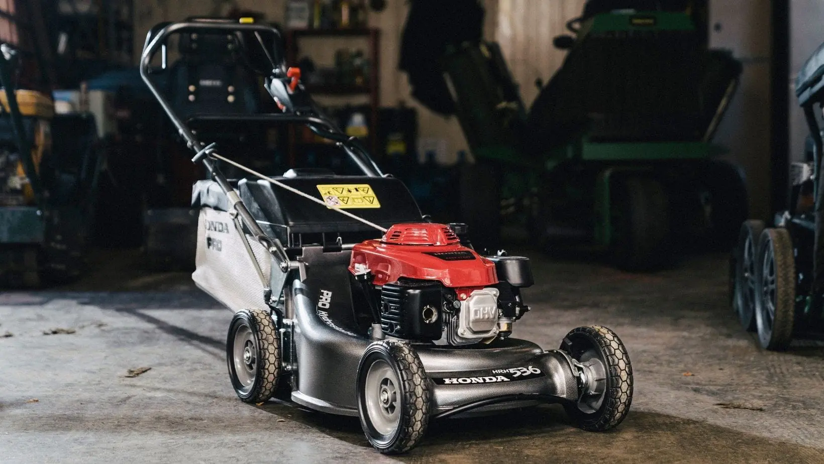 a Honda HRH536HX Petrol Lawnmower in a garage