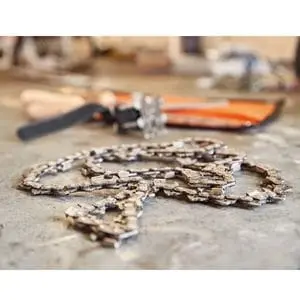 a close up of a chainsaw chain on a workbench
