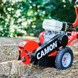 a close up of the Camon SG30 Stump Grinder grinding down a tree stump