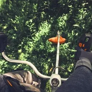 an operator's close-up view of the STIHL FSA 400 Cordless Clearing Saw in action