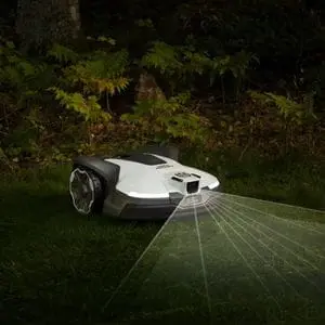 a white Husqvarna Automower on a lawn at night-time, with a graphic showing how its sensors operate