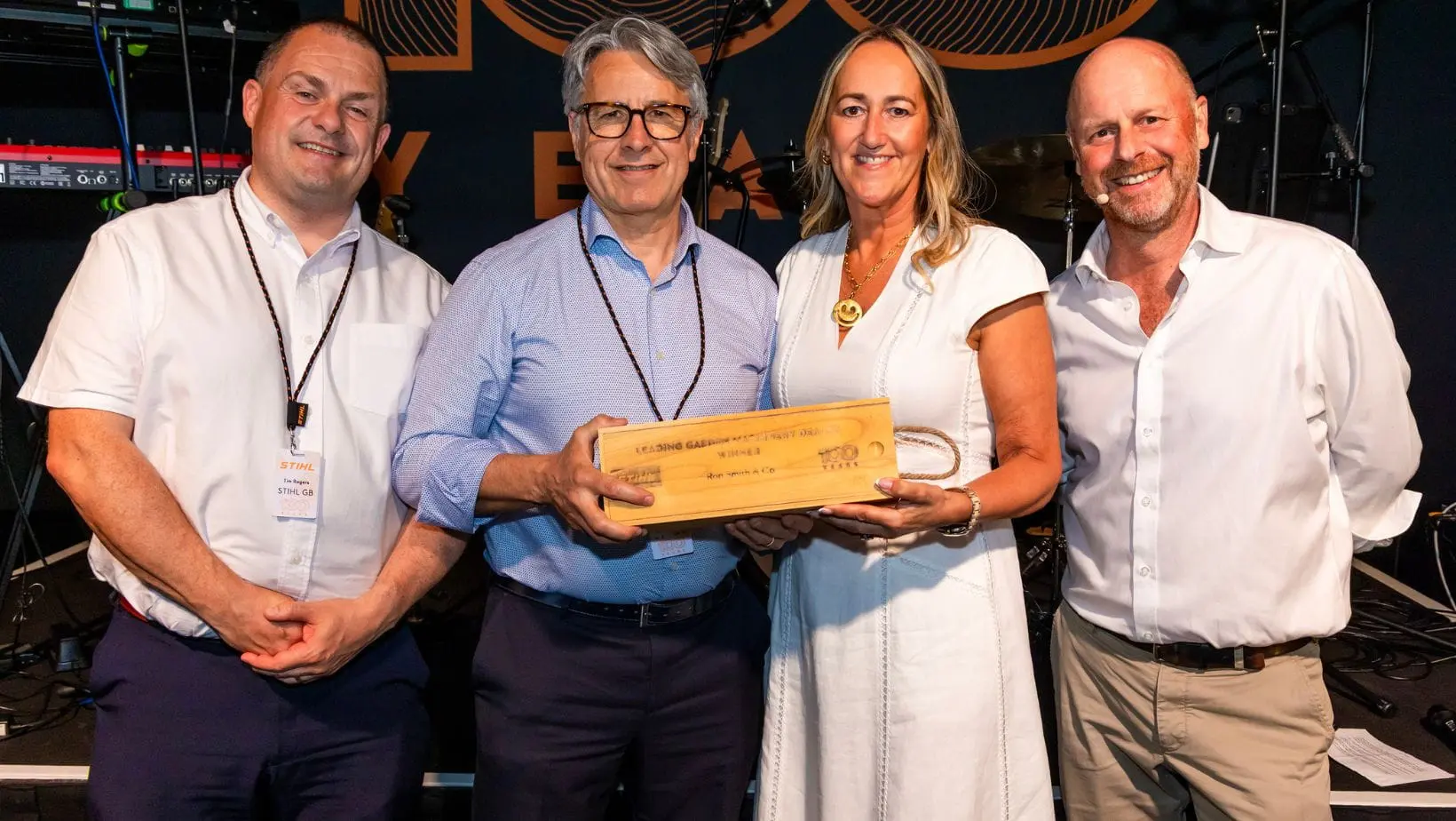 Mark Smith, Managing Director of Ron Smith & Co, receiving the STIHL 100 Year Award from Kay Green, Managing Director of STIHL GB