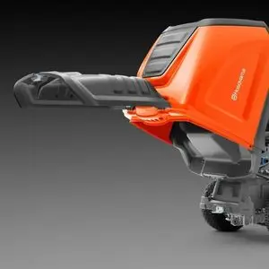 a close up of a Husqvarna RC 320Ts AWD Ride-On Mower's low-dump grass collector, set against a grey background