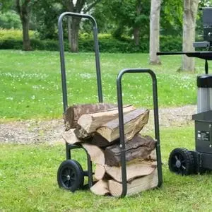a Handy THLC Log Cart, loaded with firewood, sat on a large patch of grass