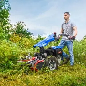 a man clearing vegetation using the BCS 780HY PowerSafe® Hydrostatic Petrol Two Wheel Tractor